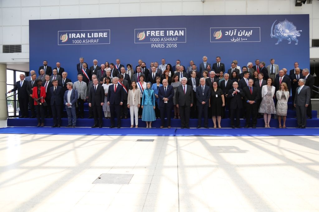 Canadian foreign minister John Baird (1st row, 4th L), Canadian retired politician Stephen Joseph (1st row, 5th L), Colombian-French politician and former senator Ingrid Betancourt (1st row, 6th L), leader of the People's Mujahedin of Iran Maryam Rajavi (1st row, 7th L), former US mayor of New York City and attorney to President Donald Trump Rudolph Giuliani (1st row, 8th L), former US Speaker of the House Newt Gingrich (1st row, 8th R), US author and Chairman of the Center for Equal Opportunity Linda Chavez (2nd row, C), Italy's former Foreign Affairs Minister Giulio Terzi di Sant'Agata (2nd row, 7th R) pose for a picture during the meeting "Free Iran 2018 - the Alternative", organised by the People's Mujahedin of Iran in Villepinte, near Paris on June 30, 2018. (Photo by Zakaria ABDELKAFI / AFP)        (Photo credit should read ZAKARIA ABDELKAFI/AFP via Getty Images)