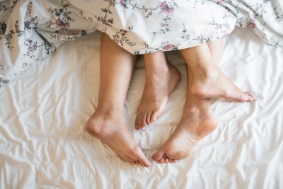 1569583500-adults-barefoot-bed-1246960