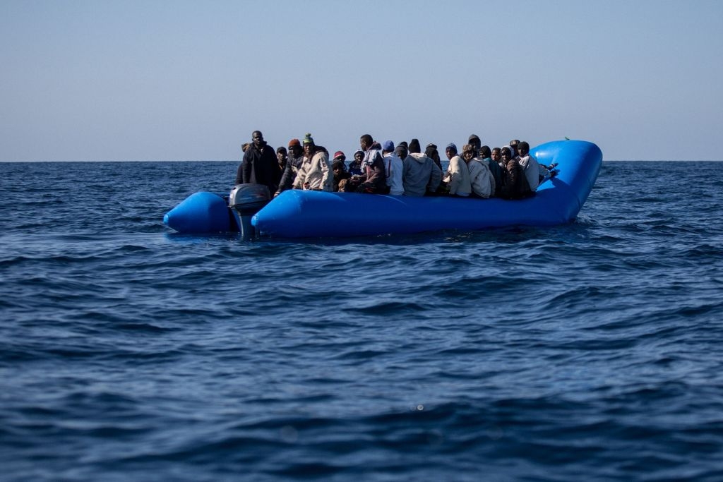 An unflatable boat with 47 migrants on board is pictured while being rescued by the Dutch-flagged Sea Watch 3 off Libya's coasts on January 19, 2019. - The German charity group Sea Watch said on January 19 that it had rescued 47 migrants from an inflatable boat, but it was not known if they belonged to the same group that was feared missing off the Libyan coast, the International Organization for Migration said on January 19 after the Italian navy flew three survivors to the Mediterranean island of Lampedusa. (Photo by FEDERICO SCOPPA / AFP)        (Photo credit should read FEDERICO SCOPPA/AFP via Getty Images)