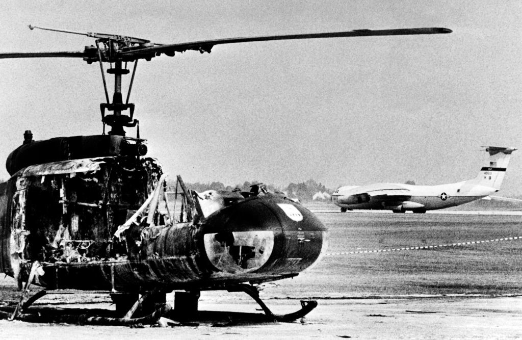 A burned-out army helicopter stands on Fürstenfeldbruck Air Base in Fürstenfeldbruck, southern Germany, after Palestinian hostage-taking, on September 7, 1972. - Palestinian members of the "Black September" group had stormed the Israeli athletes quarters, during the Munich 1972 Olympic Games, killed two and took nine other members of the Israeli Olympic team hostages before a failed freeing action of the German police forces on the Fuerstenfeldbruck airport near Munich on September 6, leaving all hostages, five of the Palestinian kidnappers and a German policeman dead. (Photo by EPU / AFP) (Photo by -/EPU/AFP via Getty Images)