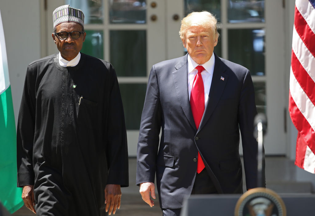 WASHINGTON, DC - APRIL 30:  U.S. President Donald Trump (R) and Nigerian President Muhammadu Buhari (L) arrive for a joint press conference in the Rose Garden of the White House April 30, 2018 in Washington, DC. The two leaders also met in the Oval Office to discuss a range of bilateral issues earlier in the day.  (Photo by Win McNamee/Getty Images)